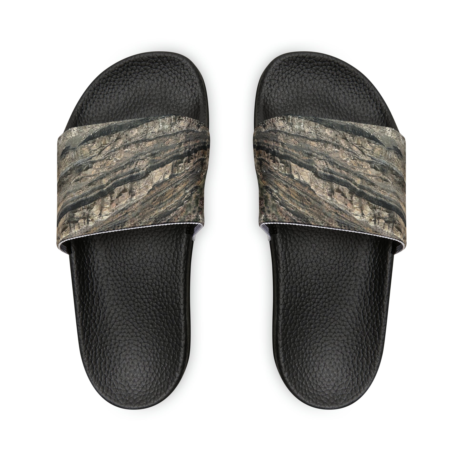 Unwind in total comfort with our easy-to-wear slide sandals, crafted with a cushioned footbed, adjustable straps for a customized fit, and a rubber outsole for durability.