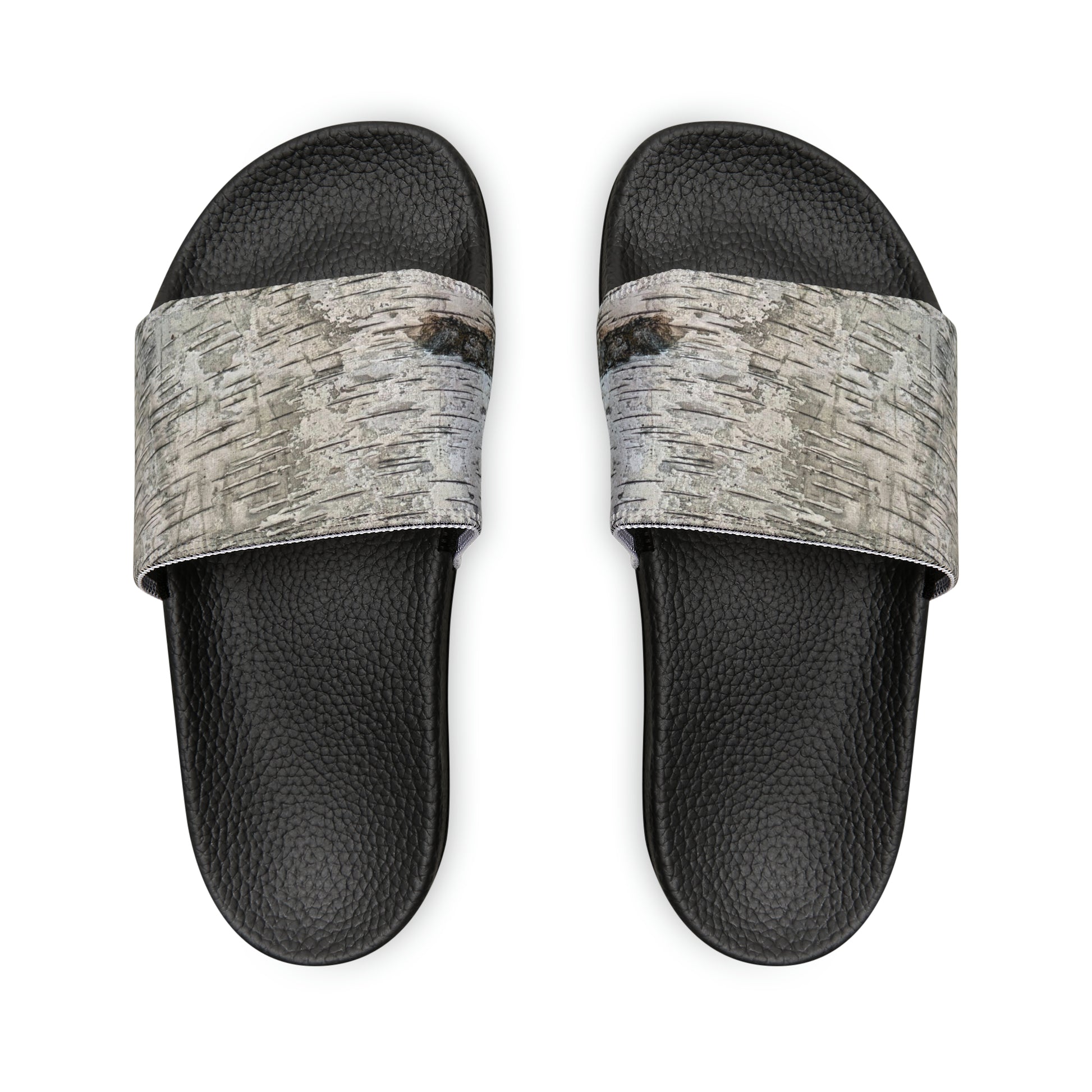 Unwind in total comfort with our easy-to-wear slide sandals, crafted with a cushioned footbed, adjustable straps for a customized fit, and a rubber outsole for durability.