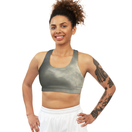 Stay cool and focused with our seamless sports bra, featuring sweat-wicking material, removable cups for customizable coverage, and a stylish design that can double as a workout top